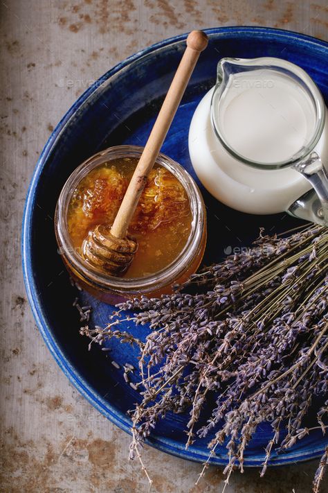 Honey, milk and lavender by NatashaBreen. Open glass jar of liquid honey with honeycomb and honey dipper inside, glass jug of milk and bunch of dry lavender in...#Open, #glass, #jar, #NatashaBreen Milk And Honey Aesthetic, Honey Pictures, Honey And Milk, Dry Lavender, Honey Art, Honey Milk, Honey Photography, Honey Packaging, Honey Water