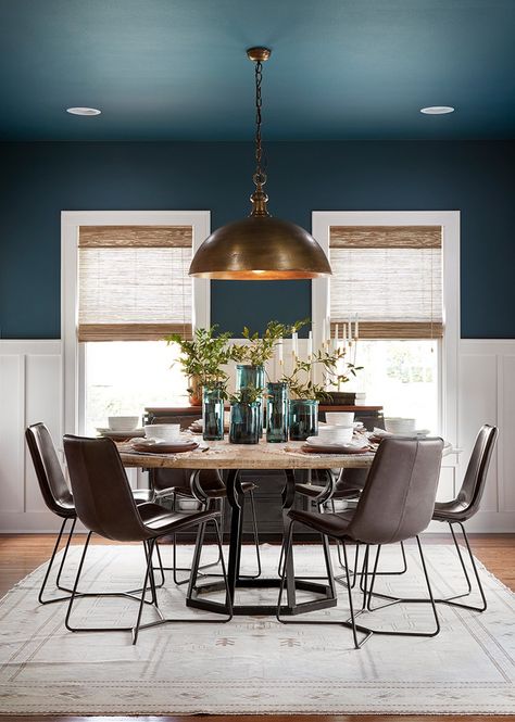 Using this deep blue jewel tone on both the ceiling and the walls really helped to define the dining room. I love the way the color is contrasted against the clean, white wainscoting and trim. Dining Room Ceiling Paint Ideas, Colors That Go With City Loft, Small Tudor Style Homes, Room With Blue Walls, Warner House, 2023 Decor, White Wainscoting, Trendy Interiors, Dining Room Blue