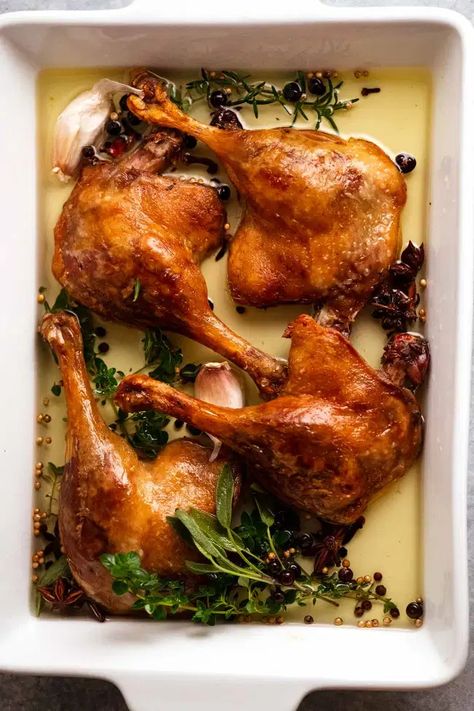 Duck Confit in a white baking dish Roasted Duck Leg, Duck Thigh Recipes, Whole Duck Confit, Braised Duck Recipes, Duck Confit Plating, Christmas Duck Recipes, Duck Leg Recipes, Duck Confit Recipe, Confit Duck Leg