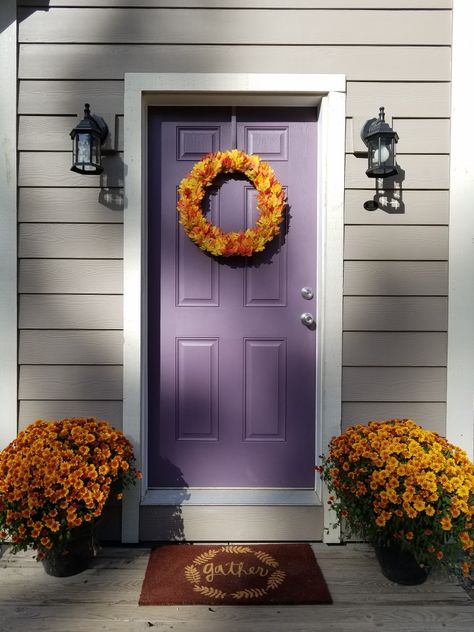 Fall Decor! Fall wreath, purple front door, orange mums, gather welcome mat Sherwin Williams Expressive Plum Plum Front Door Colors, House With Purple Door, Expressive Plum, Dark Front Door, Purple Front Door, Feng Shui Front Door, Orange Mums, Purple Front Doors, Purple Paint Colors