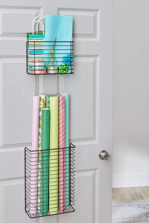 8 Easy Wrapping Paper Storage Ideas Wrapping Paper Organization Diy, Storing Wrapping Paper Rolls, Wrapping Paper Wall Storage, Gift Wrap Storage Ideas, Wrapping Paper Storage Ideas, Diy Wrapping Paper Storage, Paper Storage Ideas, Wrapping Storage, Wrapping Paper Holder