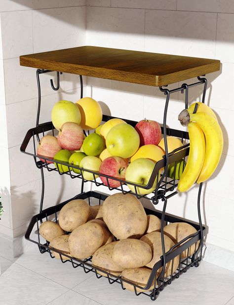 PRICES MAY VARY. Enhanced Aesthetics: The fusion of rustic wood top and classic ferric art exudes a captivating industrial charm. The sleek metal lines and elegant opening also add a touch of geometric beauty. Our 3-tier fruit basket is perfect for use on kitchen countertop and under pantry shelf. Kitchen Countertop Organizer Baskets: Keep the 3-tier fruit basket on a prominent countertop and always have delicious fruit on display, encouraging your family to enjoy healthy snacks. In addition, ea Two Tier Fruit Basket, Fruit Storage Ideas, Organizer Baskets, Basket For Kitchen, Tiered Fruit Basket, Kitchen Countertop Organization, Basket Stand, Onion Bread, Pantry Shelves