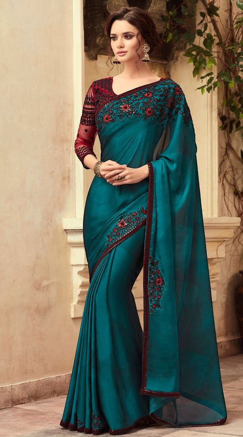 Wedding wear Teal Blue Contrast Blouse Saree Rs. 4,855.76 Teal Blue Contrast Blouse Saree is Silk Saree and Net Silk Blouse. Having Resham and Sequins Work Embroidery . This Contrast Blouse Saree is Wedding,Reception wear. This unstitched attire can be stitched. @indianbazaaronline #saree #sari #sareeblouse #sariblouse #choli #sareecholi #sheercholi @ #indianbazaaronline via @sunjayjk Indian Formals, Classic Saree, Party Wear Sarees Online, Indian Saris, Saree Beautiful, Blue Silk Saree, Banarsi Saree, Modern Saree, Saree Poses