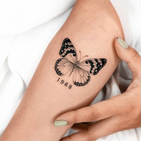 11:11 Tattoo With Butterfly, Butterfly And Year Tattoo, Butterfly With Marigold Tattoo, Butterfly Tattoo With Birth Year, Birth Year Butterfly Tattoo, Butterfly And Date Tattoo, Butterfly Tattoo With Year, Butterfly Gemini Tattoo, Bigger Tattoos For Women