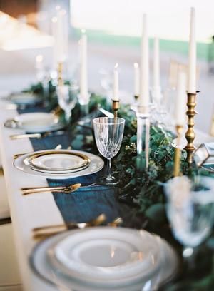 Rustic + Elegant Wedding Inspiration at The Dixie Gin Deep Teal Wedding Decor, Blue And Deep Green Wedding Decor, Forest Green And Blue Wedding, Dusty Blue Winter Wedding Table Settings, Teal Candles Wedding, Dark Teal Table Runner Wedding, Teal Blue Weddings, Blue Fall Wedding, Navy Wedding Colors