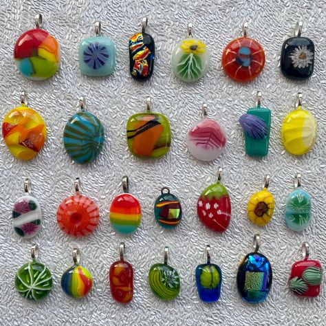 "Handmade fused glass pendants. Large range of colours, sizes and styles to choose from. There's dichroic glass, swirls, strawberries, flowers, rainbows, even a little sugar skull!  Made by layering small layers of glass on top of each other then they've been fused together in our kiln.  All pendants are one of a kind and unique. These pendants are made from recycled glass.  Come without chain / necklace. There's options for a chain to be added - there's a choice of 18\" silver plated chain or 18\" (extends up to 20\") black cord. Sizes vary. The largest is number 32 which measures 3cm x 2cm and the smallest is number 55 which measures 1.5cm x1.2cm. Please choose a colour / option from photos. Pendant numbers can be found on last few photographs. ❤️" Small Layers, Fusing Glas, Abstract Pendant, Fused Glass Necklace, Dichroic Glass Pendant, Fused Glass Pendant, Fused Glass Jewelry, Necklace Unique, Fused Glass Art