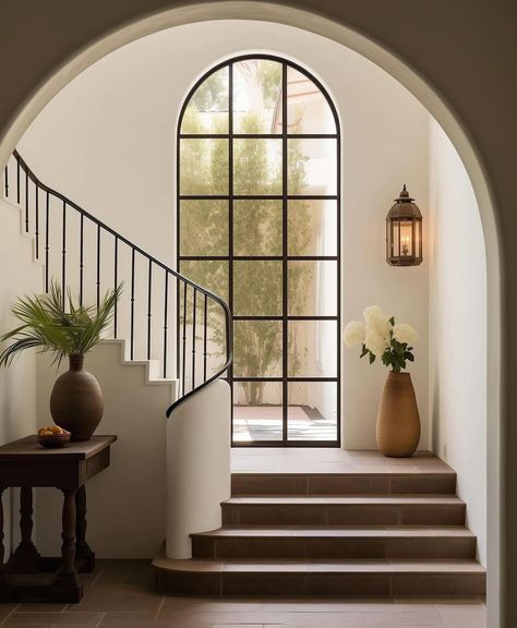 Spanish Villa Staircase, Art Deco Stairs Stairways, Classy House Aesthetic, Modern Tudor Home Interior, House With Courtyard Entrance, Beautiful Staircases Grand Entrance, Spanish House Design Interior, Spanish Architecture Interiors, Black And White Mediterranean House