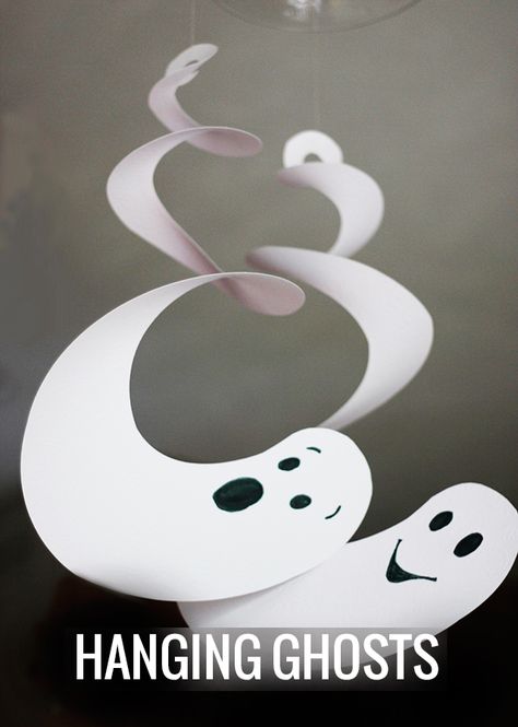 Ready for a really easy Halloween decor with high impact? Let's make some  Halloween Hanging Ghosts. These are an awesome addition to your party and  interior decorations for the season.  Inspired by these twirling spiral ghosts, I created these ghoulish  creatures that are now hanging from chandeliers and pendants all over our  house.  I love how simple they are to create from cardstock, scrapbook paper, or  posterboard. You need something that will give you extra weight so that  gravity can... Strašidelný Halloween, Halloweenpyssel Barn, Labu Halloween, Veselý Halloween, Läskig Halloween, Halloween Hanging Ghost, Dekorasi Halloween, Halloween Infantil, Ghost Crafts