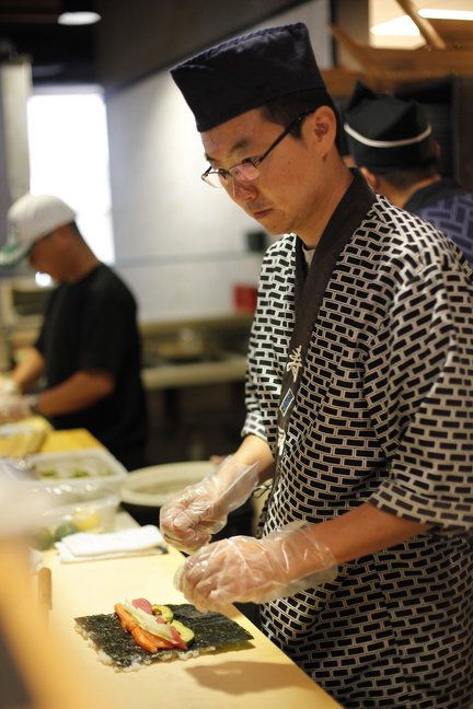 Traditionally, a sushi chef or itamae trains for 10 years before serving this Japanese food in a restaurant. Sushi Chef Uniform, Japanese Chef Uniform, Sushi Halloween Costume, Cooking Sushi, Chef Dress, Chef Design, Japanese Restaurant Design, Man Cooking, Chef Wear