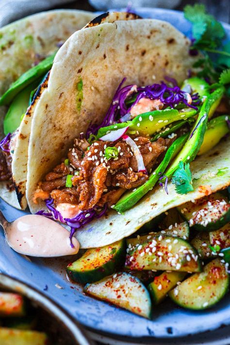 Take taco night to the next level! Korean Tacos with chicken bulgogi are so incredibly flavorful-succulent, marinated chicken is sauteed until tender and topped with fresh avocado, cabbage, and a creamy gochujang taco sauce. Tacos With Chicken, Bulgogi Tacos, Kimchi Slaw, Korean Tacos, Chicken Bulgogi, Bulgogi Marinade, Korean Cucumber, Chili Garlic Paste, Korean Chicken