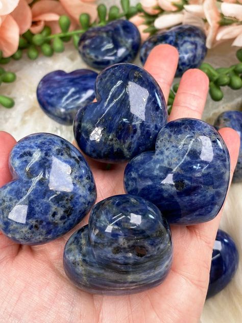 Stunning and unique blue sodalite hearts with an amazing shine! These sodalite puffy hearts are nearly an inch thick, so when I say puffy, I mean it! They all have an overall blue coloring, but the shades of blue will vary, some have whites or grays mixed in, some even have some metallic specks of either galena or pyrite. These sodalite hearts are intuitively chosen, but they are all awesome in their own way! Approx. 1.75" in size. .75" thick! You will receive ONE Sodalite heart that is intuitiv Sodalite Aesthetic, Pretty Crystals, Heart Stones, Crystal Vibes, Elven Jewelry, Magic Stones, Crystal Aesthetic, Pretty Rocks, Hanging Crystals