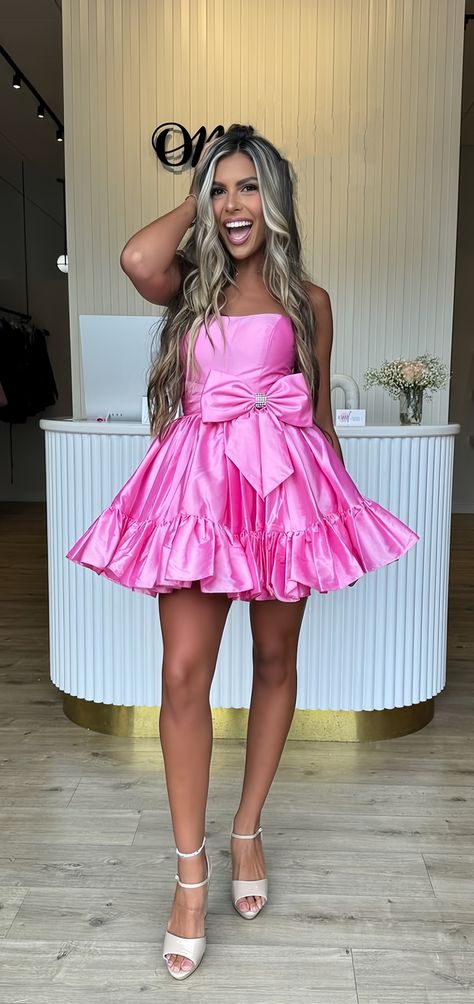 Get ready to turn heads at your next homecoming event with our Strapless Pink A-Line dress! Featuring a flattering A-line shape and a cute bowknot detail, you'll feel confident and elegant all night long. The strapless style adds a touch of femininity, making this dress a must-have for any special occasion. Dress DetailStyle: A-LineFabric: SatinColor: PinkLength: MiniNeckline: BoatSleeves: Sleeveless Pink Strapless Dress For Homecoming Prom Season, Glamorous Pink Mini Dress With Sweetheart Neckline, Glamorous Pink Strapless Homecoming Dress, Pink Mini Dress With Boned Bodice And Sweetheart Neckline, Pageant Dresses For Women, Glamorous Pink A-line Mini Dress, Barbie Pageant, Homecoming Dresses For Teens, Pink A Line Dress