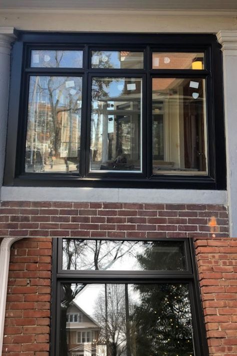 These modern black window frame contrasts well with classic brick. Provides an updated look to a dated fecade. Installed on homes in historic Toronto Canada by Delco Windows and Doors. Black Window And Door Frames, Black Window Frames Exterior Houses Uk, Black Wood Windows, Granite Door Window Frame, Black Picture Windows Exterior, Black Grid Windows Exterior, Black Windows Without Grids, Black Pvc Windows, Modern Windows Exterior Design