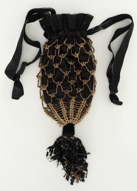 Woman's Reticule | LACMA Collections United States, circa 1860 Costumes; Accessories Bronze beads, silk satin, canaloupe seeds Length: 9 in. (22.86 cm) Victorian Purses, Victorian Accessories, 1860 Fashion, Victorian Clothing, Vintage Purses, Old Fashion, Chatelaine, Beaded Purses, Historical Costume