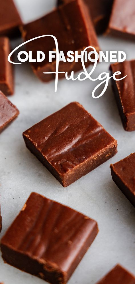 A close up of scattered squares of fudge on a marble surface. Old Fashioned Cocoa Fudge, Fruit Fudge Recipes, Best Creamy Fudge Recipe, Old Fashion Fudge Recipes Grandmothers, Fansty Fudge, Classic Fudge Recipes, Old Time Fudge Recipe, Old Fashioned Fudge Recipe, Crumbly Fudge Recipe