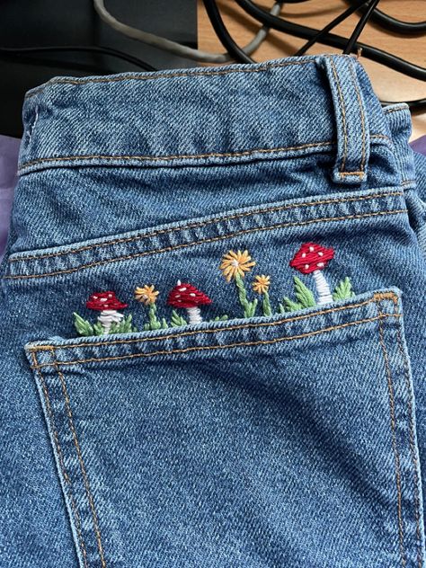 Embroidered Mushrooms On Jeans, Mushroom Embroidery On Jeans, Needlework On Jeans, Floral Embroidery On Jeans, Mushroom Embroidery Jeans, Jeans Embroidery Aesthetic, Jean Jacket Embroidery Ideas, Jeans Embroidery Ideas, Hand Embroidery Jeans