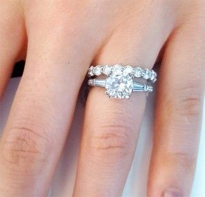 Round with tapered baguette three stone engagement ring paired with round eternity band Round Eternity Band, Jewellery Organizer, Baguette Engagement Ring, Fine Engagement Rings, Wedding Rings Round, Engagement Rings Affordable, Three Stone Engagement Ring, Moissanite Engagement Ring Solitaire, Beautiful Wedding Rings