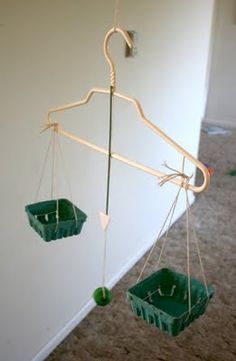 Homemade balance scale from clothes hanger (Filth Wizardry.) Steam Activities, Simple Machines, Preschool Science, Homeschool Math, Homeschool Science, Reggio Emilia, Preschool Math, Science Fair, Stem Activities