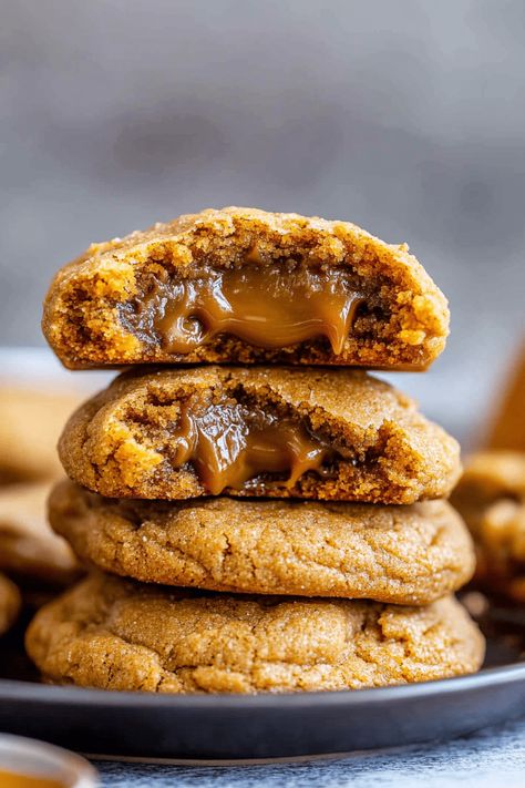 Caramel-Stuffed Pumpkin Cookies are delightfully chewy, bursting with rich pumpkin flavor, and perfect for welcoming the fall season. These cookies, although indulgent, are surprisingly simple to prepare. Embrace the essence of the harvest with a pumpkin twist and indulge your sweet cravings! As you bake these cookies, your home will be enveloped in the warm, Caramel Stuffed Pumpkin Cookies, Stuffed Pumpkin Cookies, Easy Thanksgiving Cookies, Autumn Cookies, Stuffed Pumpkin, Skillet Pan, Thanksgiving Cookies, Pecan Cookies, Caramel Candy