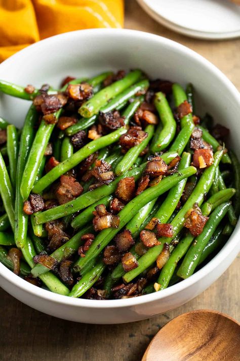 Green beans with bacon and onion are PACKED with flavor, with perfect crisp-tender green beans every time. This family-favorite side dish comes together with simple ingredients and fits any menu, whether a weeknight dinner or a holiday meal. Maple Bacon Green Beans, Green Beans Bacon Onion, Bacon Green Beans Recipe, Cook Fresh Green Beans, Recipe For Green Beans, Pan Green Beans, Bacon Bits Recipes, Marinated Green Beans, Bacon Side Dishes