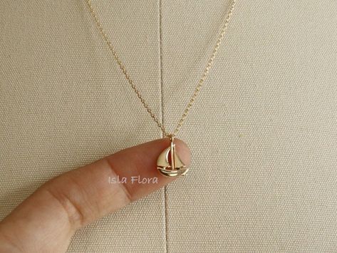 Beautifully crafted Sail Boat necklace, see through between the sails and top. Tiny details from the curve of the boat to the steerer, Super Cute and Dainty -18k Gold Dipped -18k White Gold Dipped * Brass Casting * Lead & Nickel Free ◾ MEASURES * Necklace Length: 16" plus 1.5" adjustable chain * Pendant Width: 0.5" * Pendant Height: 0.7" * Closure: Lobster Claw ◾ CARE: * Treat delicately to extend its life. Clean only with a soft, dry cloth. * Chain/Pendants are gold plated so please avoid conta Sailboat Jewelry, Boat Necklace, Toddler Earrings, Sailboat Necklace, Hand Jewelry Rings, Jewelry Layering, Ocean Necklace, Casual Jewelry, Sail Boat