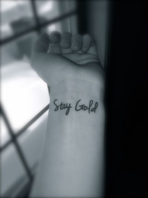 Stay Gold. My newest tattoo. Never become jaded, love the simple things in life that you've ceased to appreciate, and remain true to your youthful self! Outsider Tattoo Ideas, Stay Gold Tattoo The Outsiders, The Outsiders Tattoo, Outsiders Tattoo, Stay Gold Tattoo, Swag Tattoo, Font Tato, Nerdy Tattoos, Tiny Wrist Tattoos