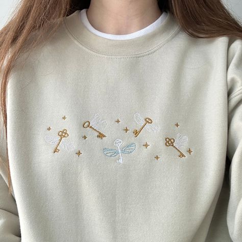 Embroidered Sweatshirt Flying Keys, Custom Embroidered Shirt, Book Sweatshirt, Bookish Sweatshirt, Fantasy Sweatshirt, Wizard Sweatshirt - Etsy Flying Keys, Cloud Craft, Cute Embroidery, Embroidery Sweatshirt, Newborn Crochet, Comfy Sweatshirt, Embroidered Sweatshirt, Custom Sweatshirts, Appliqué Patch