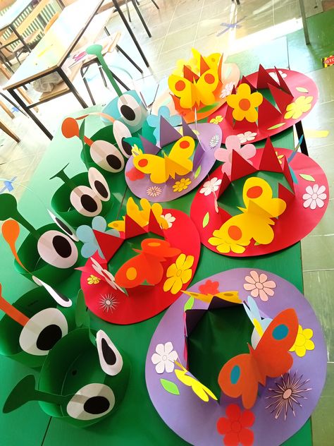 Spring Hat Crafts For Preschoolers, Spring Hat Day At School, Spring Hats For Kids Preschool, Spring Hats For Kids Diy, Spring Sun Straw Hat Made Of Paper, Spring Crowns For Kids, Playful Spring Hats For Play, Crazy Hat Day Ideas For Kids, Paper Bug Hats For Kidd