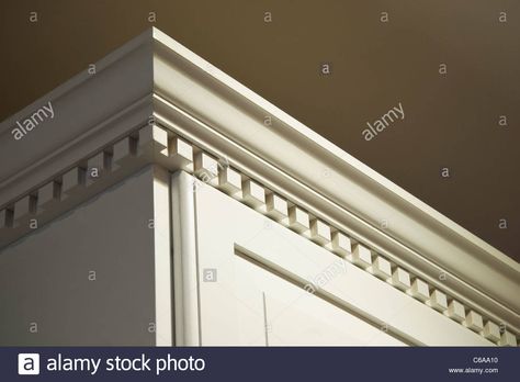 The Top Crown Moulding Dentil Detail On Some Creme-color Painted Stock Photo, Royalty Free Image: 38336060 - Alamy Stock Kitchen Cabinets, Solid Wood Kitchen Cabinets, Solid Wood Kitchen, Crown Moulding, Trim Work, Wood Kitchen Cabinets, Simple Addition, Creme Color, Kitchen Upgrades