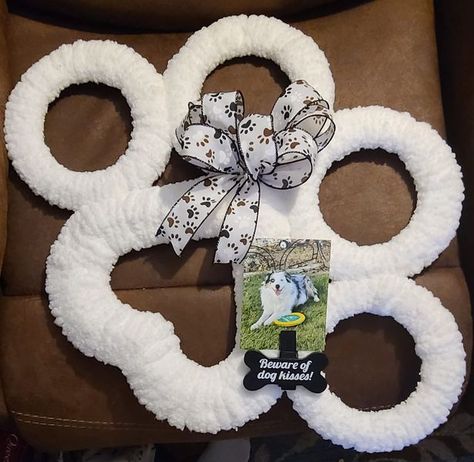 Dollar Tree Fanatics Crafts & Decor | I made this paw print wreath for my son, using one heart wire frame, four small round wire frames & clear zip ties from DT | Facebook Paw Print Wreath Diy Dollar Tree, Dollar Tree Dog Paw Wreath, Paw Wreath Diy, Paw Print Wreath Diy, Dog Paw Wreath Diy, Dog Paw Wreath, Heart Wreath Frame, Paw Print Wreath, Dog Gnome