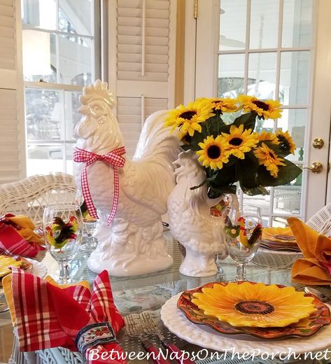 Rooster-Sunflower-Themed Table Setting with White Ceramic Rooster Centerpiece Sunflower Table Setting, Simple Table Centerpieces, Sunflower Table, Old Time Pottery, White Charger, Spring Entertaining, Country Rooster, Ceramic Rooster, Spring Tablescapes