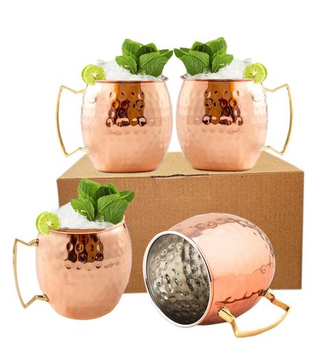 PRICES MAY VARY. Set of 4 hammered stainless steel 19 ounces Moscow mule mugs : 100% Handcrafted, manually Hammered I Equipped with a comfortable, easy to hold, 100% pure brass handle. Barrel Shape : The round shape and shiny exterior of the mug gives a royal look to it and is sure to make a great addition to your Moscow mule collection. Made up of Food Safe Materials : Instead of copper, this product is made up of high-quality Stainless Steel and then Copper plated to get a lustrous finish. Hig Mocktails Non Alcoholic Thanksgiving, Moscow Mule Gift Basket, Moscow Mule Gift, Mule Mugs, Booth Designs, Moscow Mule Cocktail, Moscow Mule Recipe, Copper Cups, Copper Mugs