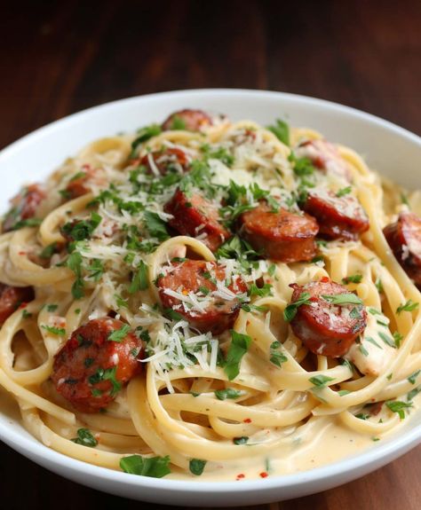 Smoked Sausage Cajun Alfredo - Yeyfood.com: Recipes, cooking tips, and kitchen hacks for home cooks of all levels Smoked Sausage Cajun Alfredo, Cajun Alfredo, Turkey Sausage Recipes, Smoked Sausage Pasta, Hacks For Home, Food Critic, Andouille Sausage, Andouille, Turkey Sausage