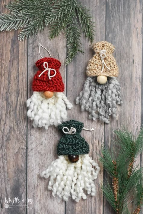 These cute crochet woodland ornaments add some rustic woodsy charm to your Christmas tree! The pattern includes a cute gnome, an acorn, and a sweet mushroom! Crochet Christmas Gnome Ornaments, Gnome Christmas Ornaments Diy, Crochet Gnome Ornament, Easy Crochet Christmas Ornaments, Diy Crochet Ornaments, Diy Crochet Christmas, Christmas Gnome Crochet, Woodland Crochet, Rustic Crochet