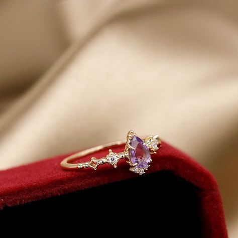 This dainty amethyst engagement ring features with a genuine high quality teardrop purple amethyst. It's a good choice for teardrop engagement ring. Features * Made to Order. * Material: 925 Silver with Gold Plated * Gold Color: Yellow Gold * Stone Type: Natural Purple Amethyst & CZ * Ready to Ship in 7-10 Business Days Want to find out more? Check out my shop https://www.etsy.com/shop/ZoeJewelryStudio Thank you for taking the time to look at my shop. I hope you enjoy my designs as much as I enj Purple Moissanite Engagement Ring, Wedding Ring With Amethyst, Vintage Purple Engagement Rings, Amythest Wedding Rings, Promise Rings Purple, Rapunzel Engagement Ring, Wedding Rings Amethyst, Purple Rings Engagement, Teardrop Amethyst Ring