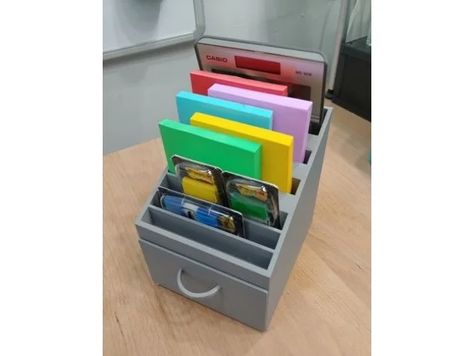 Designed as an organizer for a collection of too many post-it notes. I added a drawer because, why not, plus there was extra space in the model. This can hold five new packs of three inch square note pads, two four by six inch pads, and an unspecified, random collection of flags and tiny post-it notes. This is a design matching the sizing of my other design, Large pen organizer with dividers.Remember to print with internal supports for the drawer overhang. 3d Printed Organizer, 3d Printed Coin Sorter, 3x3 Post It Note Holders, 3d Printed Socket Organizer, Notes Storage, Acrylic Frame Post It Note Holder, Pen Organizer, Post It Holder, Sticky Note Holder