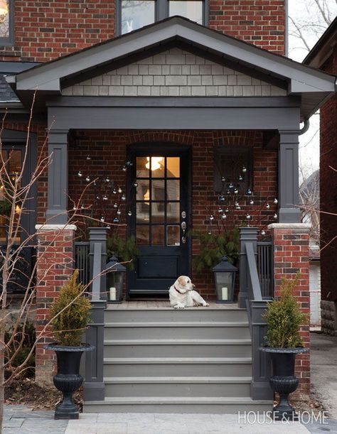 Branches adorned with silver and blue baubles add interest to this front porch. | Photographer: Donna Griffith | Designer: Ingrid Oomen Red Brick House Exterior, Red Brick Exteriors, Red Brick House, Front Porch Ideas Curb Appeal, Brick Exterior House, Porch Steps, Front Steps, Exterior Paint Colors For House, Exterior Makeover