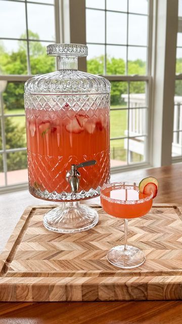 Samantha Bauchmann on Instagram: "STRAWBERRY TEQUILA PUNCH / think of it like a margarita + a strawberry spritzer had a baby, and that’s this cocktail 🥰 light, refreshing & you only have to make one batch for an entire party. INGREDIENTS: 4 cups frozen strawberries 2 cups blanco tequila 1 cup Cointreau 1 cup lime juice 1/2 cup sugar 1 bottle brut sparkling wine / champagne 2 liters sparkling water Salt + sugar for rim Lime wheels + strawberry slices for garnish Ice INSTRUCTIONS: 1) Add frozen strawberries, tequila, cointreau, lime juice and sugar to a blender. Blend thoroughly. Pour contents into a drink dispenser, add sparkling water + sparkling wine/champagne. Add ice, lime wheels & strawberry slices for garnish. 2) When ready to serve, rim edge of glass with a lime wedge and dip into Mocktail Drink Dispenser, Beverage Dispenser Stand Diy, Margarita Dispenser, Sparkling Wine Punch, Punch Dispenser, Strawberry Spritzer, Samantha Bauchmann, Tequila Punch, Sparkling Water Cocktail