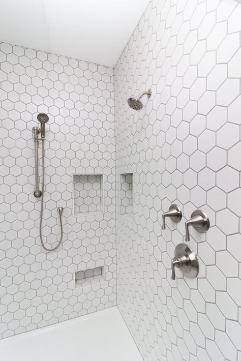 A fun white 2 inch hexagon tiled shower. White Hexagon Tile Bathroom Shower Wall, Hexagon White Tile Bathroom, Hex Tile Shower Wall, Small White Hexagon Tile Bathroom, Hexagon Shower Wall Tile, Hexagon Tile Bathroom Shower Wall, Hexagon Tile Shower Wall, Hexagon Shower Tile, White Hexagon Tile Bathroom