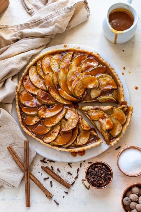 This is an incredible, classic applie pie filling made in a super flakey and delicious pastry crust. The crust is packed with cinnamon, allspice, and cloves and then the tart is topped with easy, homemade caramel sauce. Seriously this is a caramel apple in a tart. It's the perfect fall dessert! #falldesserts #applepie #appletart #thanksgiving #thanksgivingdesserts #pie #tart Venison Stew Slow Cooker, Tart Apple Pie, Caramel Apple Tart, Apple Tarte, Slow Cooker Chicken Tortilla Soup, Tart Crust, Apple Tart Recipe, Caramel Pie, Yams Recipe