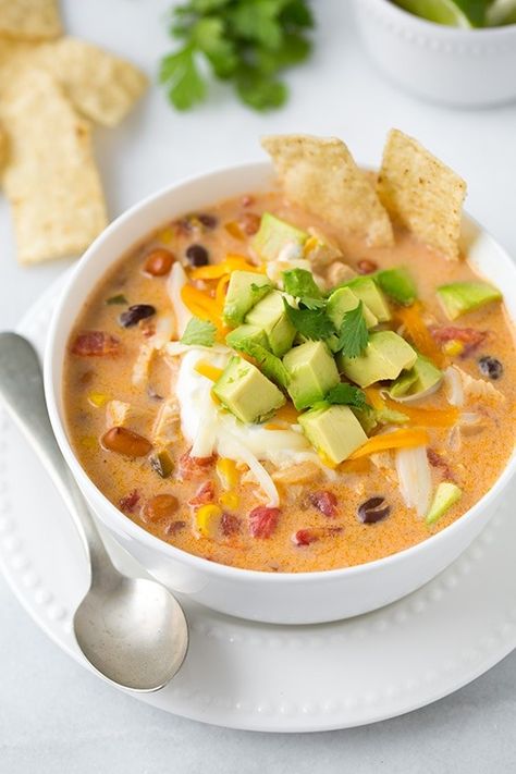 Creamy Chicken Tortilla Soup. A hearty, warming and comforting soup made with juicy chicken, vegetables and loaded with delicious toppings. Best of all this soup is whipped up in under 30 minutes and couldn't be easier! | Chicken Soup | Mexican Soup | #veggiesdontbite #soup #chicken #tortilla Creamy Tortilla Soup Recipe, Chicken Soup Mexican, Soup Chicken Tortilla, Cheesy Chicken Tortilla Soup, Creamy Chicken Tortilla Soup, Soup Chicken, Comforting Soup, Tortilla Soup Recipe, Mexican Soup