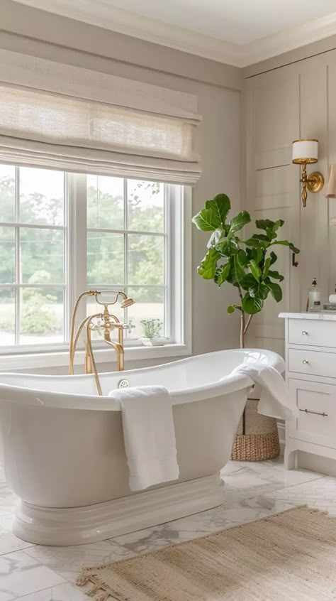 Inspiring Taupe Bathroom Ideas That Are Far From Boring - Decoholic Bathtub In Front Of Window, French Master Bath, Bathroom Ideas Bathtub, Taupe Bathroom Ideas, Bath Under Window, Tile Around Tub, Stand Alone Bath Tub, Standalone Tub, Hotel Style Bathroom