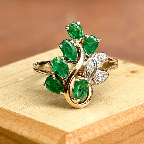 Estate/ vintage 14KT yellow gold cocktail/ statement ring with genuine, Colombian emeralds + genuine, white diamonds. Marquise emeralds in a cluster diamonds set in white gold, illusion setting. Size 6.5 Weight: 3 grams 6 pear genuine emeralds 3 round diamonds Not stamped or hallmarked, but tested Excellent estate condition Emerald Cocktail Ring, Gold Cocktail, Colombian Emeralds, Emerald Jewelry, Pretty Rings, Diamond Cluster Ring, Diamond Cluster, Emerald Diamond, White Diamonds