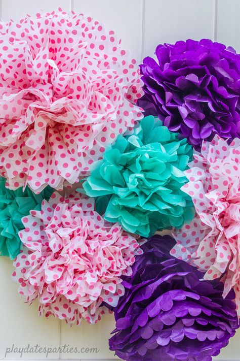 Here, you’ll learn how to make tissue paper pom poms and find out if it’s worth the DIY time or if it makes more sense to buy them for your events. Make them big or make them small, tissue paper pom poms are a cheap and easy party decoration that packs a punch. String them up hanging from the ceiling at a baby shower or birthday party, turn them into a garland, or even in a bunch on a wall. #DIYpartydecor #partyideas #partycrafts #crafts #paperflowers #partyplanning Diy Tissue Pom Poms, How To Make Tissue Paper Pom Poms, Tissue Paper Pom Poms Diy Hanging, Diy Tissue Paper Pom Poms, Tissue Paper Pom Poms Diy, Make Tissue Paper Pom Poms, Diy Tea Party, Easy Party Decorations, Diy Tea