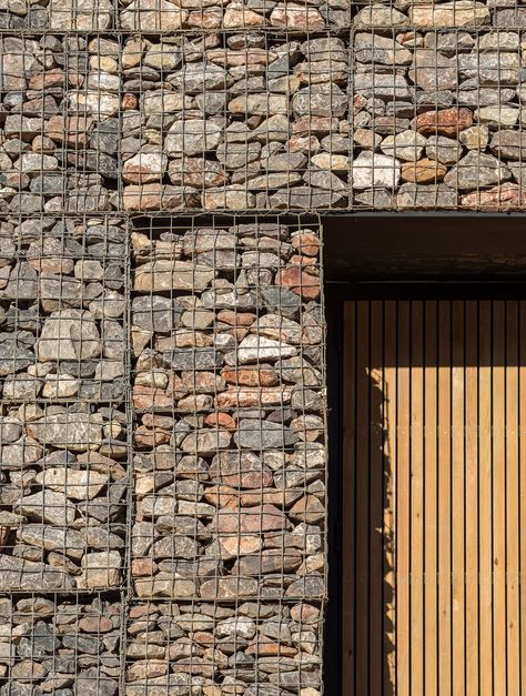 Stone-filled gabions help this police training centre by architecture firm Haverstock to camouflage with the craggy walls of a former quarry in Bristol, England. Modern Eco Friendly Home, Gabion Stone, Police Training, Eco House Design, Gabion Wall, Stone Facade, Architectural Photographers, Facade Architecture, Brick And Stone