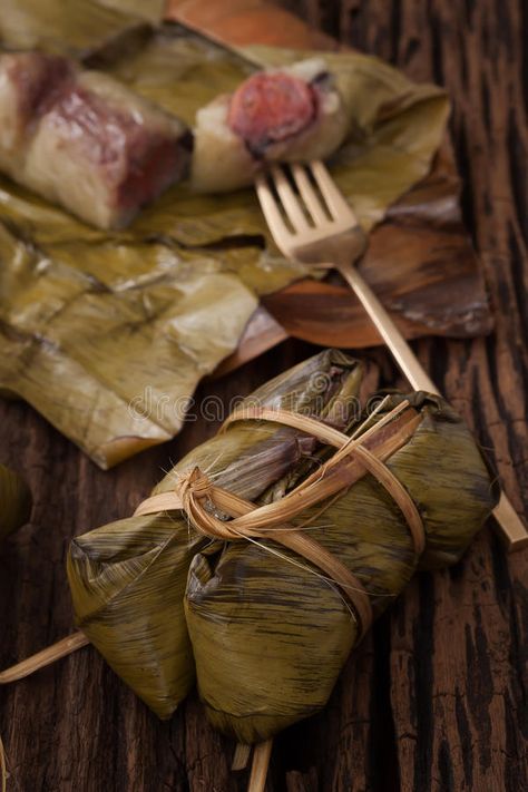 Thai Dessert Recipes, Recipes Black Beans, Khao Tom, Thai Recipes Dessert, Thai Dessert, Sticky Rice, Wooden Background, Banana Leaf, Black Beans