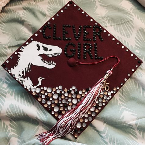 Graduation Cap Designs How To Train Your Dragon, Jurassic Park Graduation Cap, Dinosaur Graduation Cap, How To Train Your Dragon Graduation Cap, Animal Science Graduation Cap Ideas, Pixar Graduation Cap, Clever Girl Jurassic Park, Creative Graduation Caps, College Grad Cap Ideas