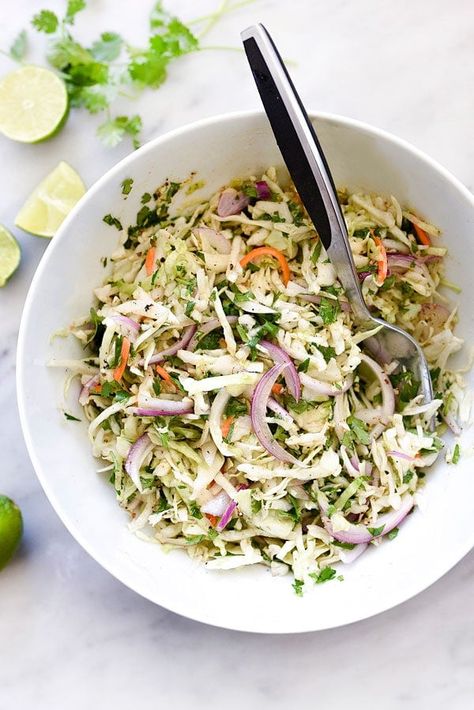 Easy Mexican Coleslaw Recipe | foodiecrush.com Sides With Tacos, Mexican Coleslaw, Healthy Potluck, Taco Dishes, Taco Side Dishes, Potluck Salad, Avocado Rice, Potluck Side Dishes, Vegan Coleslaw