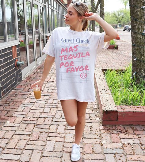 Más Tequila Por Favor T-Shirt - Funny Guest Check Tee, Trendy Oversized Drinking Shirt, Girls' Night Out, Bachelorette Party Outfit Get the party started with this Más Tequila Por Favor T-shirt! Featuring a fun restaurant guest check design with bold pink lettering, this tee is perfect for tequila lovers, margarita enthusiasts, and anyone who enjoys a good time. Whether you're going out for drinks, hitting up Taco Tuesday, or celebrating a bachelorette party, this oversized graphic tee will make a statement! 🍹 Why You'll Love It: ✔️ Trendy Relaxed Fit: Comfy, casual, and effortlessly stylish - SIZE UP FOR AN OVERSIZED LOOK ✔️ Premium Soft Fabric: 100% Cotton, soft and breathable for all-day wear. ✔️ Perfect for Any Occasion: Great for vacations, brunch, girls' nights, and fiesta celebrati Cocktail Tshirt, Fun Restaurant, Night Out Bachelorette Party, Cocktail Margarita, Tequila Gift, Out For Drinks, Guest Check, Tequila Shirt, Cool Restaurant