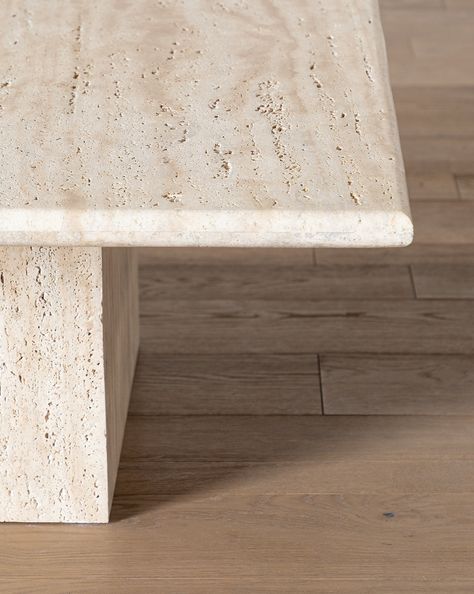 Handmade and manually molded, our Travertine Coffee Table is truly mesmerizing. The coffee table is crafted entirely from unfilled travertine stone, giving it a beautiful organic texture that plays with the natural marbling of the stone. Simple in shape, the table makes a subtly elegant statement wherever it is placed. | McGee & Co. | Travertine Coffee Table